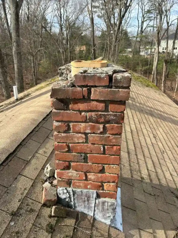 Damaged chimney with missing bricks- Local Chimney Services